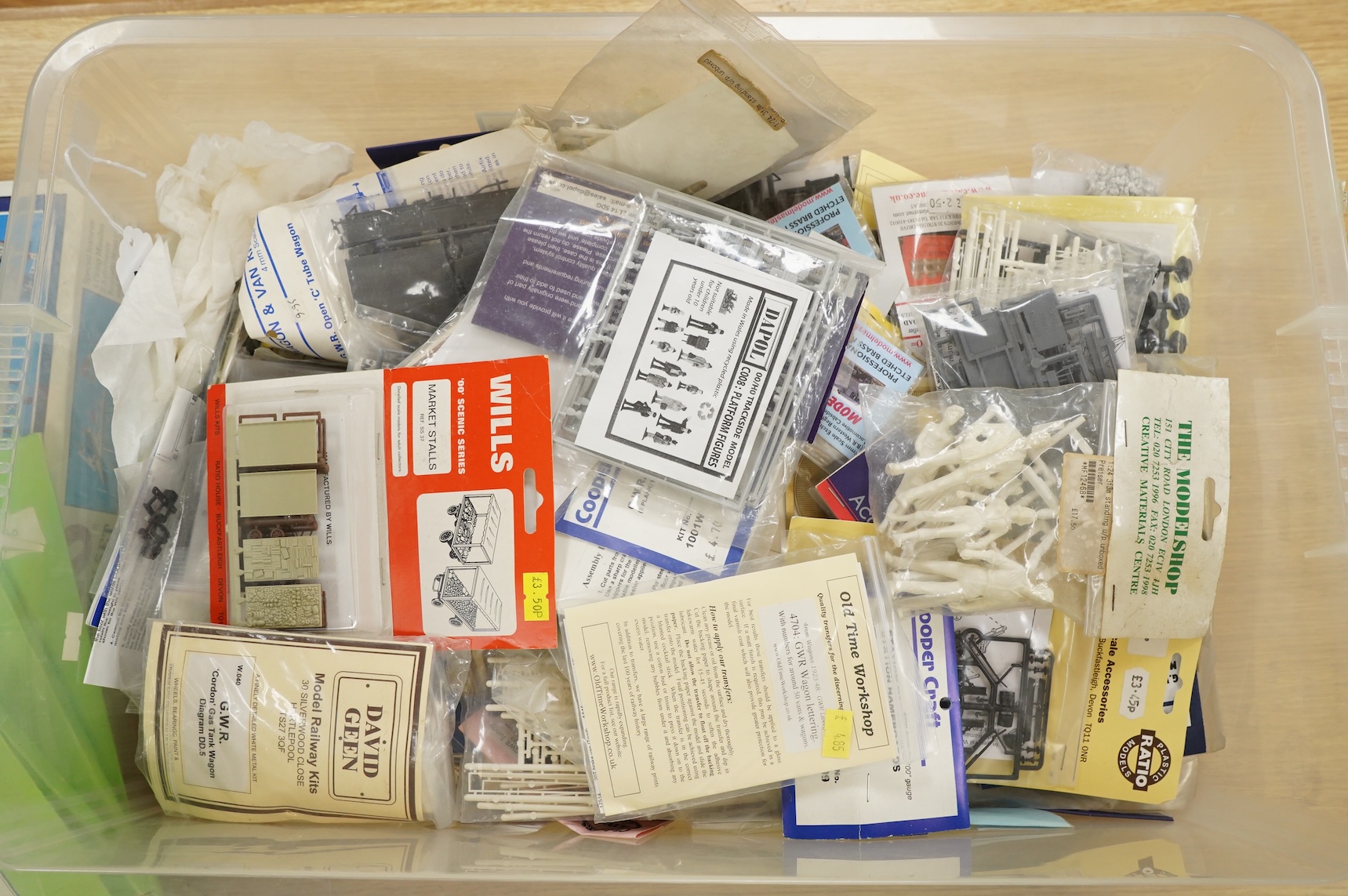 A collection of 00 gauge model railway, including three box train sets by Jouef, Mainline and Hornby, together with a large selection of unconstructed railway related plastic and metal kits and accessories, manufacturers